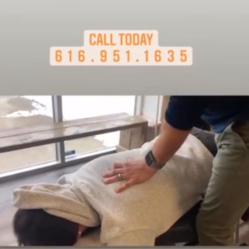 Postnatal chiropractor, Dr Dusten McIver is doing a chiropractic adjustment.
